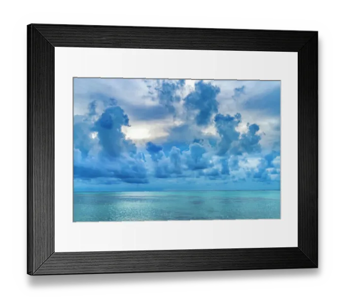 Framed Print : Cloudscape, Moorea, Tahiti, French Polynesia. Different blue colors in water in lagoon and coral reefs
