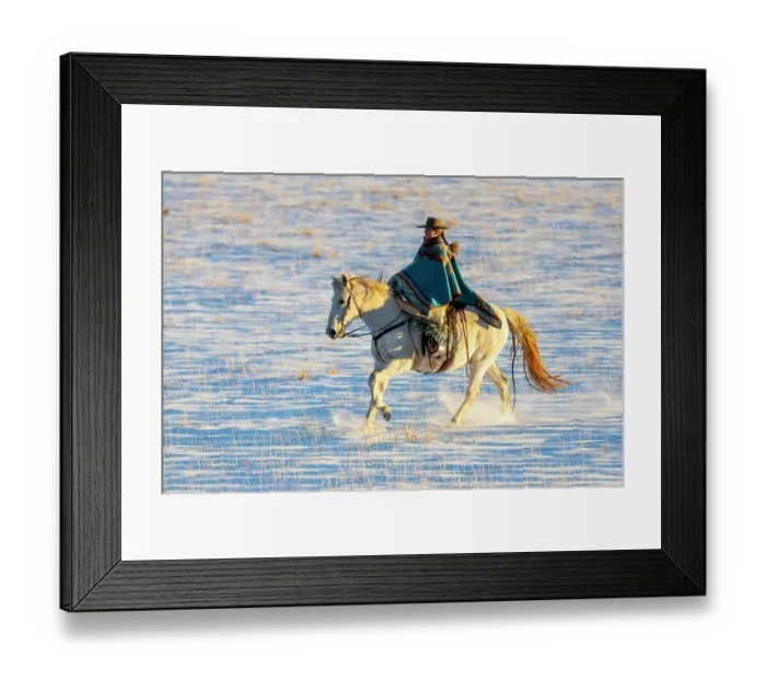 Framed Print : USA, Shell, Wyoming. Hideout Ranch cowgirl riding her horse in the snow. (PR, MR)