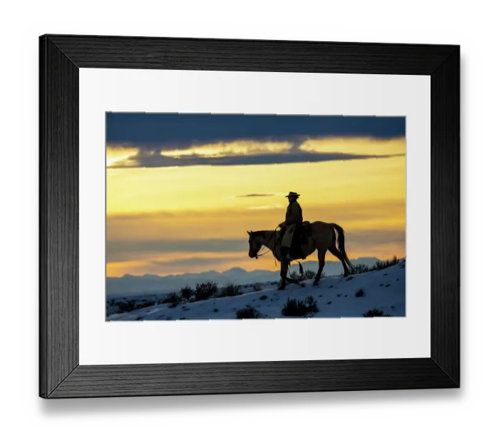 Framed Print : USA, Shell, Wyoming. Hideout Ranch cowgirl silhouetted on horseback at sunset. (PR, MR)