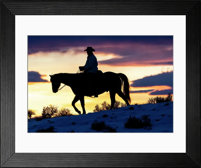Framed Print : USA, Shell, Wyoming. Hideout Ranch cowboy on horseback silhouetted at sunset. (PR, MR) Framed Print : USA, Shell, Wyoming. Hideout Ranch cowboy on horseback silhouetted at sunset. (PR, MR)