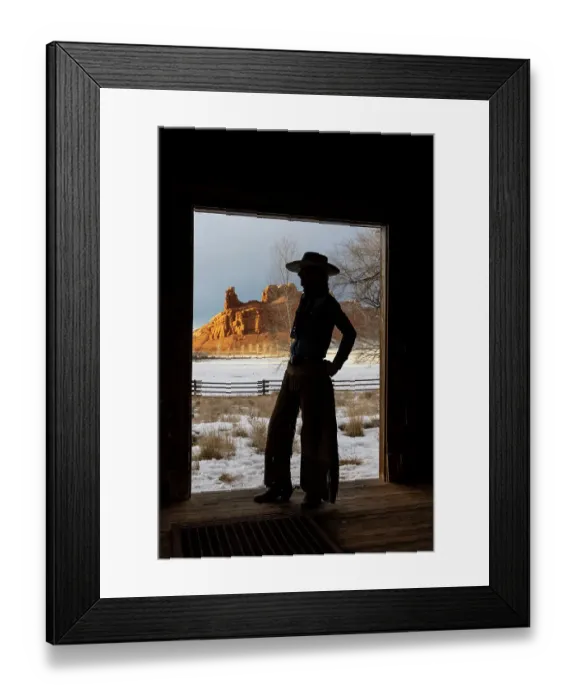 Framed Print : USA, Shell, Wyoming. Hideout Ranch with cowgirl silhouetted in doorway of log cabin. (PR, MR) Framed Print : USA, Shell, Wyoming. Hideout Ranch with cowgirl silhouetted in doorway of log cabin. (PR, MR)