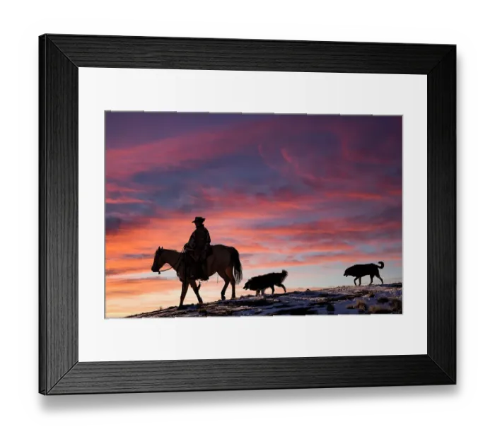 Framed Print : USA, Shell, Wyoming. Hideout Ranch cowgirl and her two dogs horseback riding at sunset. (PR, MR) Framed Print : USA, Shell, Wyoming. Hideout Ranch cowgirl and her two dogs horseback riding at sunset. (PR, MR)