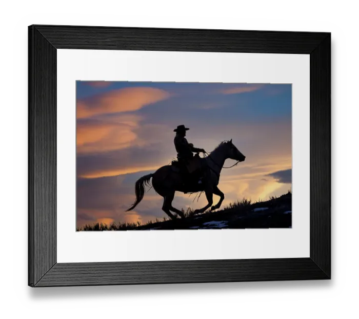 Framed Print : USA, Shell, Wyoming. Hideout Ranch cowboy on horseback silhouetted at sunset. (PR, MR) Framed Print : USA, Shell, Wyoming. Hideout Ranch cowboy on horseback silhouetted at sunset. (PR, MR)