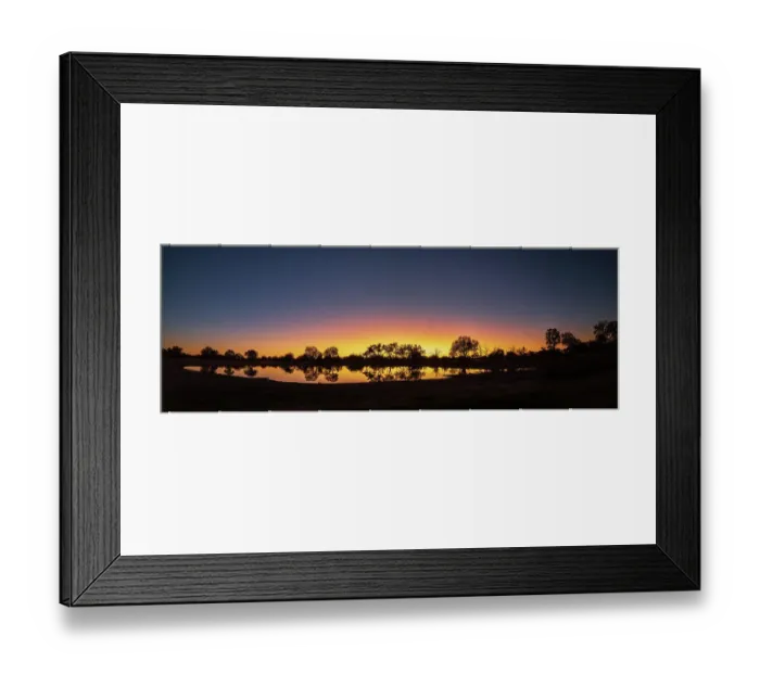 Framed Print : Colorful sunset at watering hole. Camelthorn Lodge. Hwange National Park. Zimbabwe Framed Print : Colorful sunset at watering hole. Camelthorn Lodge. Hwange National Park. Zimbabwe