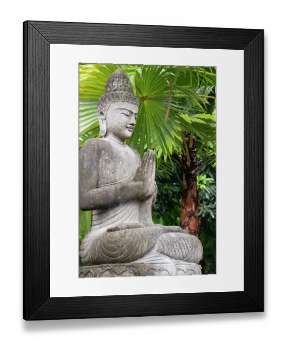 Framed Print : Indonesia, Bali. Buddha statue with green palms