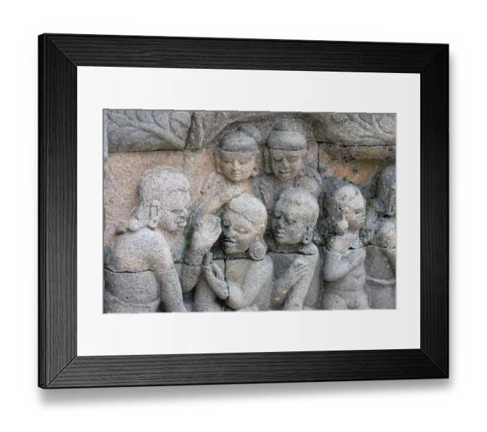 Framed Print : Indonesia, Java, Borobudur. Largest Buddhist monument in the world. UNESCO. Detail of carved stone figures in the hidden foot