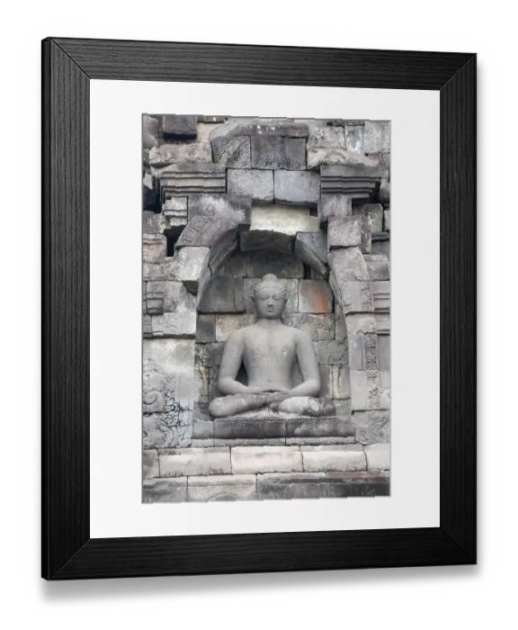 Framed Print : Indonesia, Java, Borobudur. Largest Buddhist monument in the world. UNESCO. Buddha statue in ornate wall Framed Print : Indonesia, Java, Borobudur. Largest Buddhist monument in the world. UNESCO. Buddha statue in ornate wall