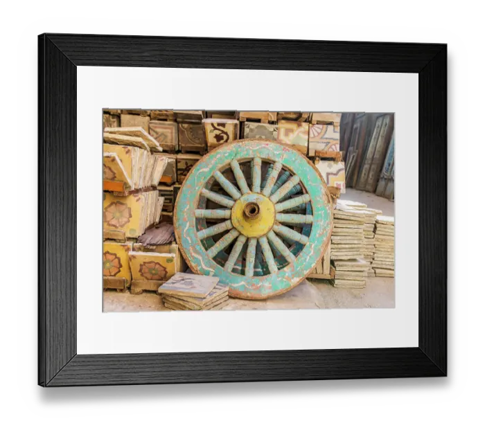 Framed Print : Old Cairo, Cairo, Egypt. Wooden cart wheel and floor tiles in an alley in Cairo