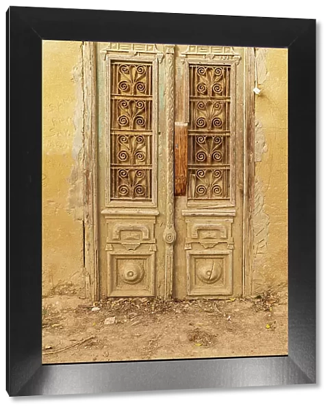 Faiyum, Egypt. Wooden door on a building