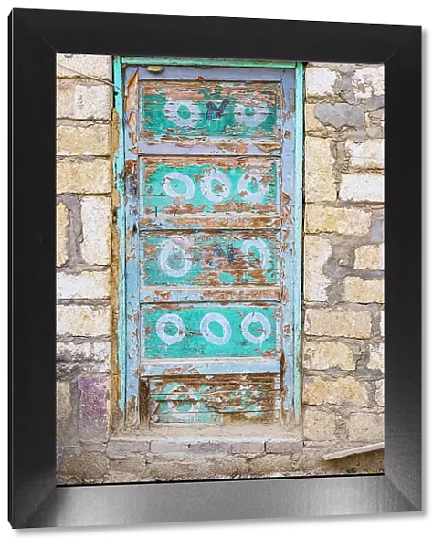 Faiyum, Egypt. A blue painted door on a building