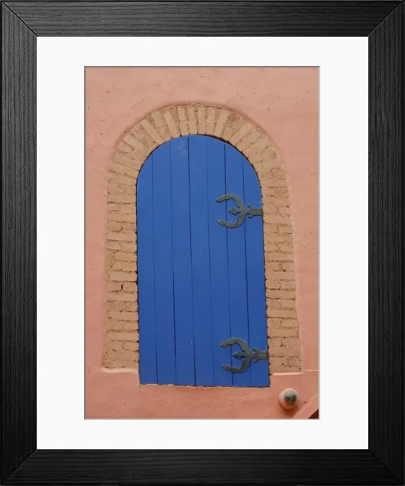 Framed Print : Marrakech, Morocco. Blue gate situated on old wall