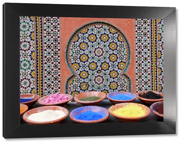 Marrakech, Morocco. Clay bowls of spices and bluing with tile background