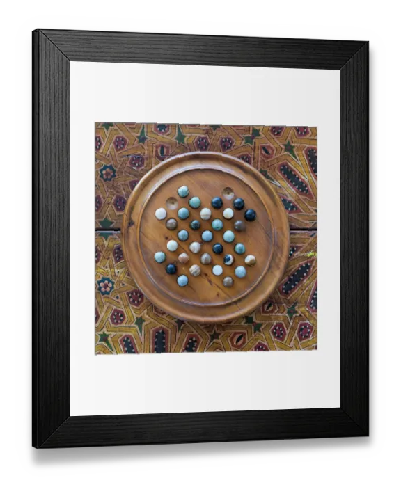Framed Print : Fes, Morocco. Wooden game of marbles