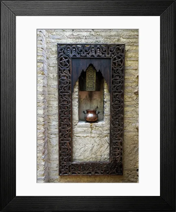 Framed Print : Fes, Morocco. Old copper pot sits on a ledge with a carved wooden frame Framed Print : Fes, Morocco. Old copper pot sits on a ledge with a carved wooden frame