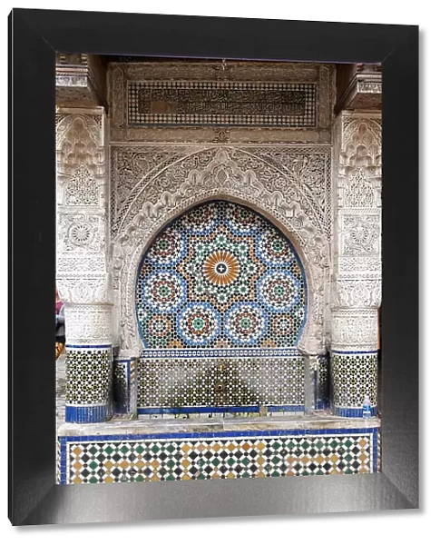 Fes, Morocco. One of the 300 tiles fountains in the medina. Most are located next to a mosque