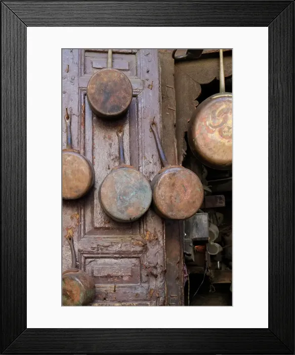 Framed Print : Fes, Morocco. Antique copper pans for sale in the medina