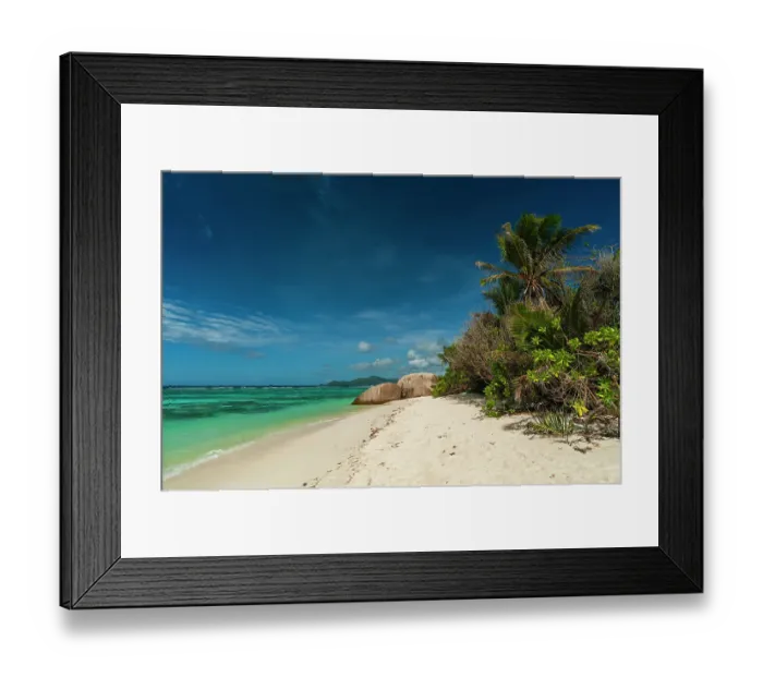 Framed Print : A sandy tropical beach with palm trees and large boulders on the Indian Ocean. Anse Source d Argent Beach, La Digue Island, Seychelles