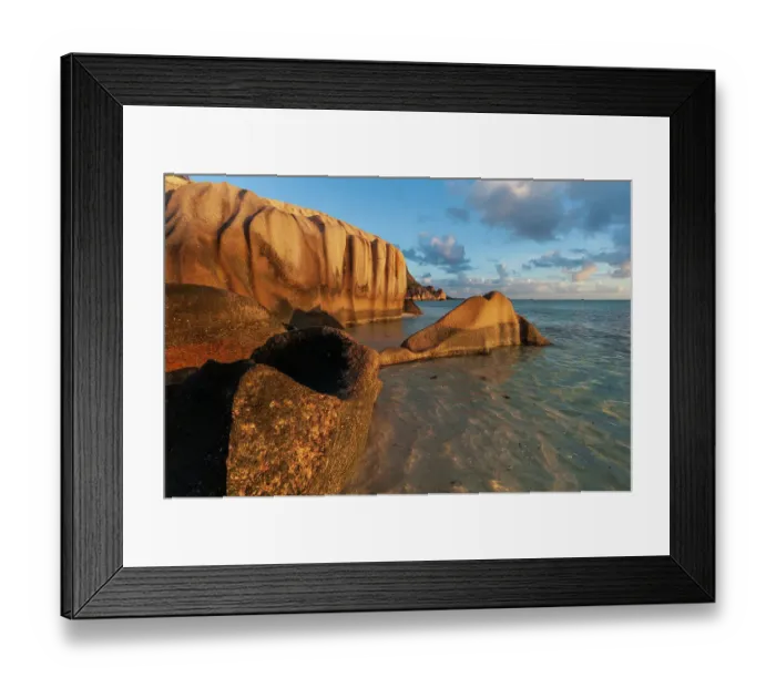 Framed Print : Rock formations on a tropical island beach in warm sunlight at sunset. Anse Source d Argent Beach, La Digue Island, Seychelles Framed Print : Rock formations on a tropical island beach in warm sunlight at sunset. Anse Source d Argent Beach, La Digue Island, Seychelles
