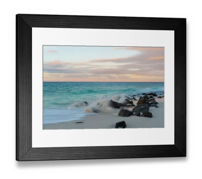 Framed Print : Indian Ocean surf crashing on to rocks on a tropical beach at sunset. Anse Bambous Beach, Fregate Island, Seychelles