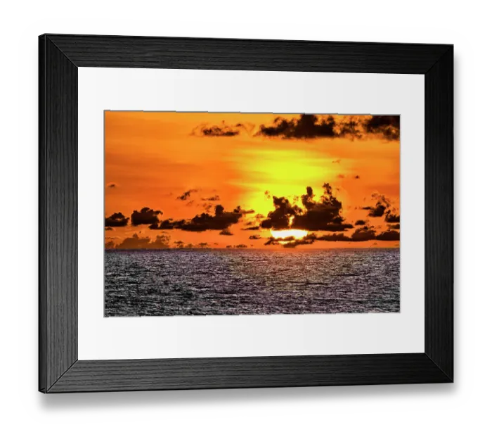 Framed Print : The crimson light of the setting sun reflects a red glow on the beach at Pererenan Beach, Bali, Indonesia Framed Print : The crimson light of the setting sun reflects a red glow on the beach at Pererenan Beach, Bali, Indonesia