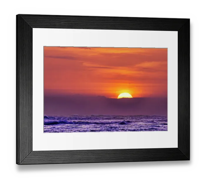 Framed Print : Each evening the incredible colors of the setting sun becomes a tourist mecca on the beaches of Bali, Indonesia Framed Print : Each evening the incredible colors of the setting sun becomes a tourist mecca on the beaches of Bali, Indonesia