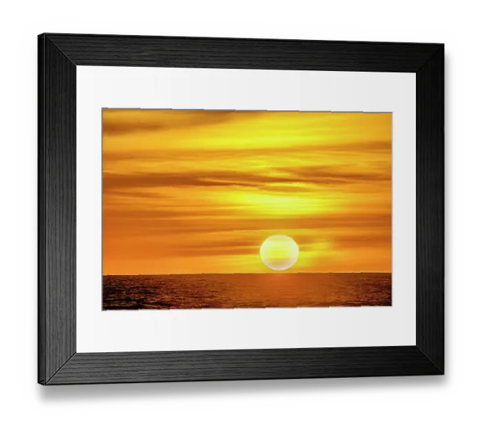 Framed Print : The golden light of the swirling clouds sunset reflects a pink glow on the beach at Pererenan Beach, Bali, Indonesia