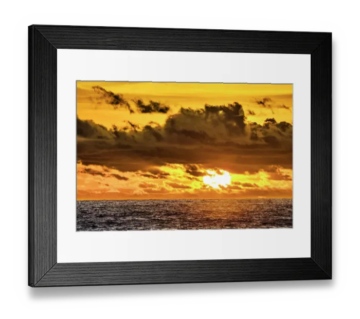 Framed Print : The crimson light of the setting sun reflects a red glow on the beach at Pererenan Beach, Bali, Indonesia Framed Print : The crimson light of the setting sun reflects a red glow on the beach at Pererenan Beach, Bali, Indonesia
