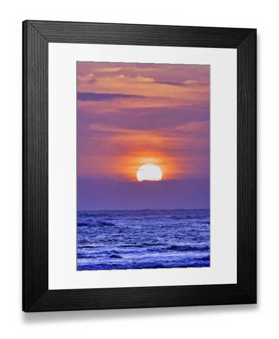 Framed Print : Nightly ritual when tourists gather to watch the amazing sun setting over the Indian Ocean at Pererenan Beach, Bali, Indonesia
