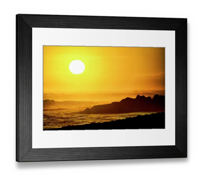Framed Print : Each evening the incredible colors of the setting sun becomes a tourist mecca on the beaches of Bali, Indonesia Framed Print : Each evening the incredible colors of the setting sun becomes a tourist mecca on the beaches of Bali, Indonesia