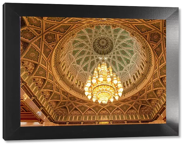 An ornate ceiling in the men's prayer room of the Sultan Qaboos Grand Mosque, Muscat, Oman