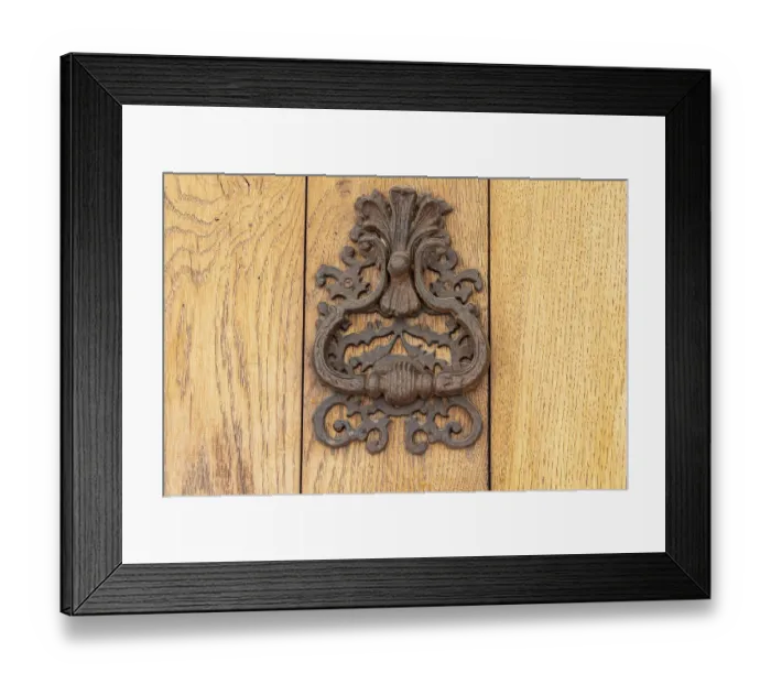 Framed Print : Aigues-Mortes, Gard, Occitania, France. An old rusted knocker on a wooden door