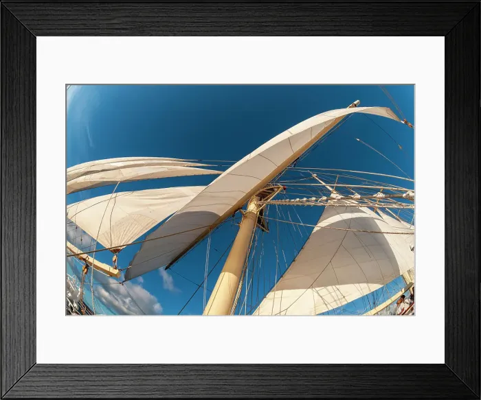 Framed Print : Looking up the at a mast and sails of a barquentine cruise ship. Deshaies, Basse Terre Island, Iles des Saintes, Guadeloupe, West Indies