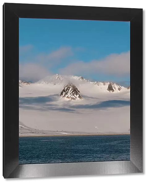 A scenic view of the ice covered mountains surrounding Magdalenefjorden, Spitsbergen Island, Svalbard, Norway