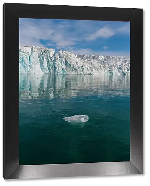 Lilliehook Glacier reflects on arctic waters. Lilliehookfjorden, Spitsbergen Island, Svalbard, Norway