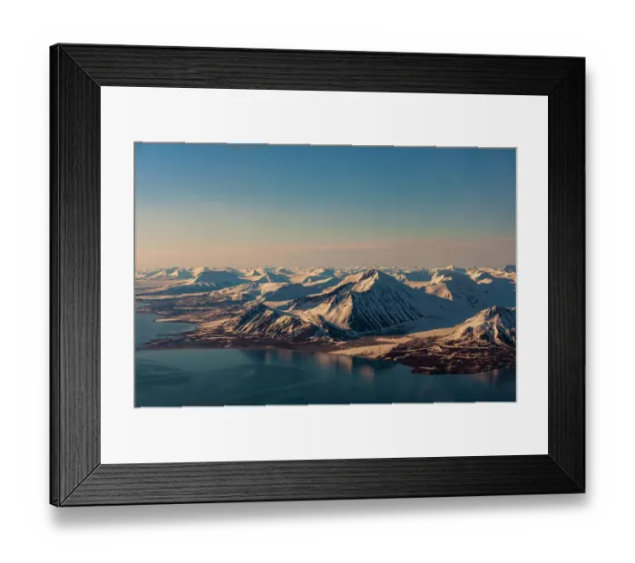 Framed Print : Sunlight highlights ice covered mountains on Spitsbergen Island, Svalbard, Norway Framed Print : Sunlight highlights ice covered mountains on Spitsbergen Island, Svalbard, Norway