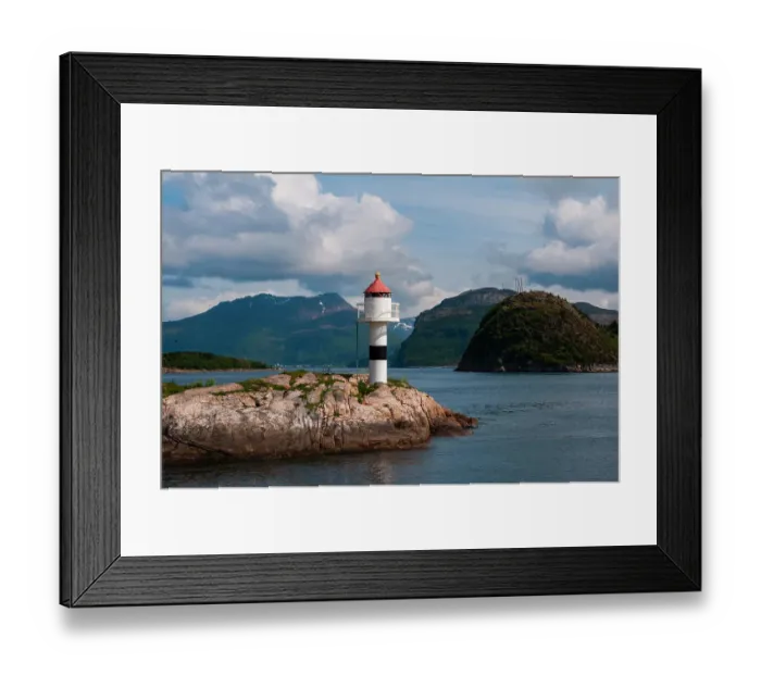 Framed Print : A small lighthouse perched on a rock promontory in Hollandsfjord, Svartisen, Norway Framed Print : A small lighthouse perched on a rock promontory in Hollandsfjord, Svartisen, Norway