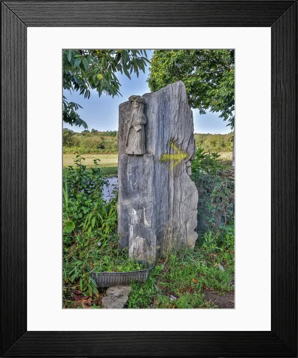 Framed Print : Spain, Galicia. Stone carving of a pilgrim along the Camino de between Ventras de Naron and Palas de Rei