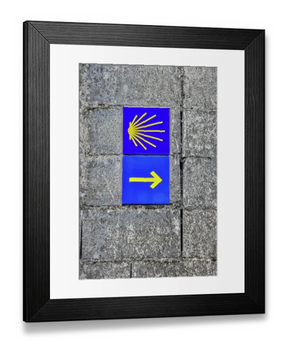 Framed Print : Spain, Galicia. Yellow arrow and clam shell along the Camino de Santiago (Way of St. James) between Lavacolla and Santiago de Compostela