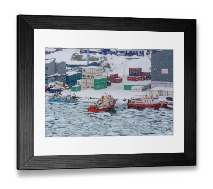 Framed Print : Fishing boats in the frozen harbor during a snow storm. Ilulissat, Greenland. (Editorial Use Only) Framed Print : Fishing boats in the frozen harbor during a snow storm. Ilulissat, Greenland. (Editorial Use Only)