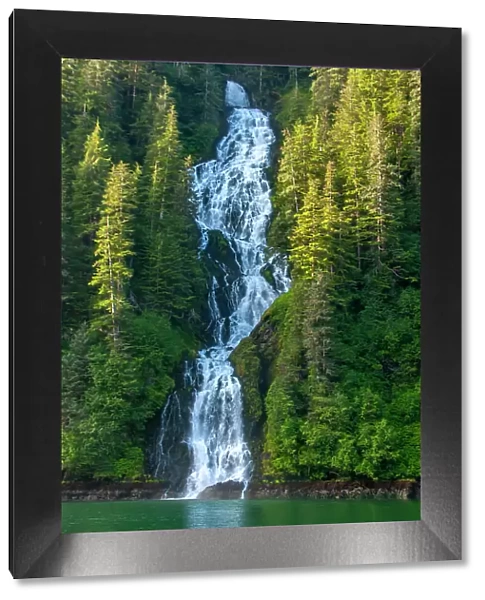 USA, Alaska, Tongass National Forest. Waterfall into Red Bluff Bay