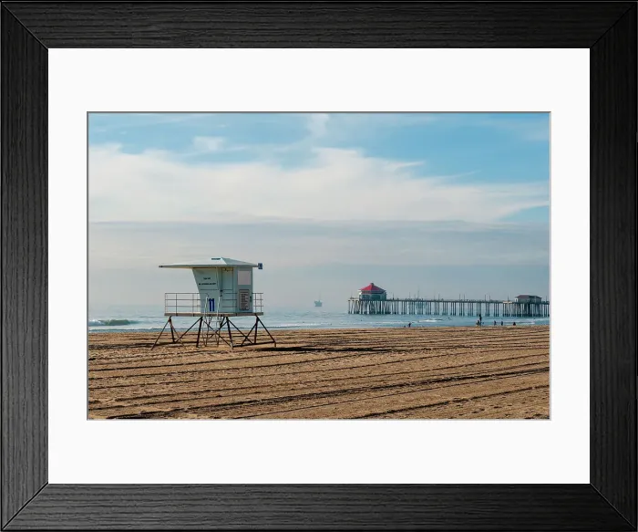 Framed Print : Lifeguard shack and pier on almost deserted Huntington Beach, on the Pacific Ocean, California