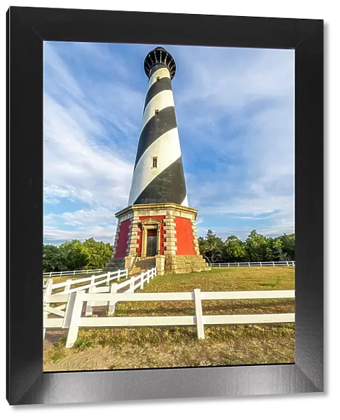 USA, North Carolina, Buxton. Cape Hatteras Lighthouse in late afternoon sun