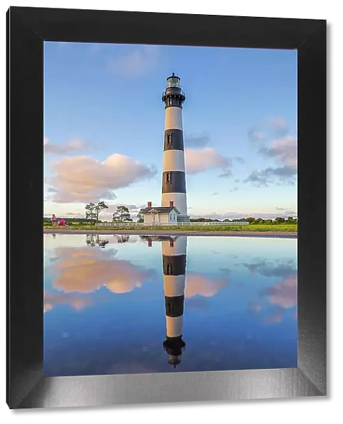 USA, North Carolina, Nags Head. Bodie Island Lighthouse reflection in a puddle