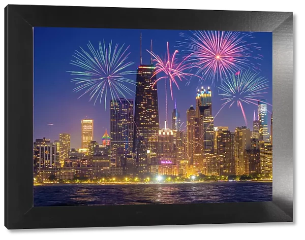 USA, Illinois, Chicago. Composite of downtown skyline and fireworks. (Editorial Use Only)