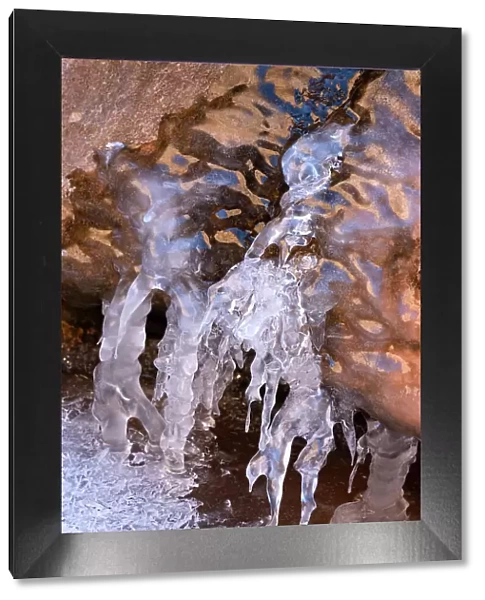 USA, Utah. Ice formations with sky and canyon wall reflections, Arches National Park