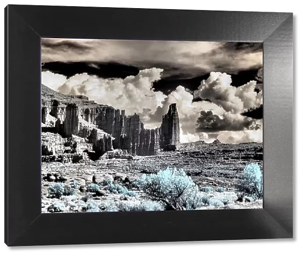 USA, Utah. Infrared of Fisher Towers with large clouds
