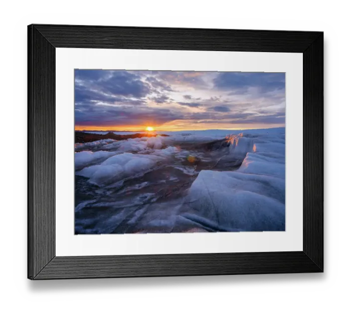 Framed Print : Midnight sun on the ice sheet. The brown sediment on the ice is created by the rapid melting of the ice. Landscape of Greenland near Kangerlussuaq, Kingdom of Denmark Framed Print : Midnight sun on the ice sheet. The brown sediment on the ice is created by the rapid melting of the ice. Landscape of Greenland near Kangerlussuaq, Kingdom of Denmark