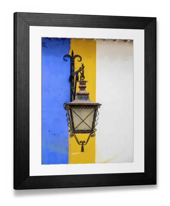 Framed Print : Portugal, Obidos. Wrought iron lantern hanging from a colorful stripped wall in the walled town Framed Print : Portugal, Obidos. Wrought iron lantern hanging from a colorful stripped wall in the walled town