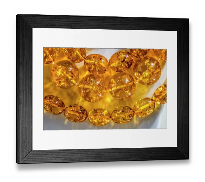 Framed Print : Colorful golden Baltic amber, Gdansk, Poland. Amber capital of the world. Amber 40 million years old. Found Gdansk Beaches 6000 years. Plant pollen in amber