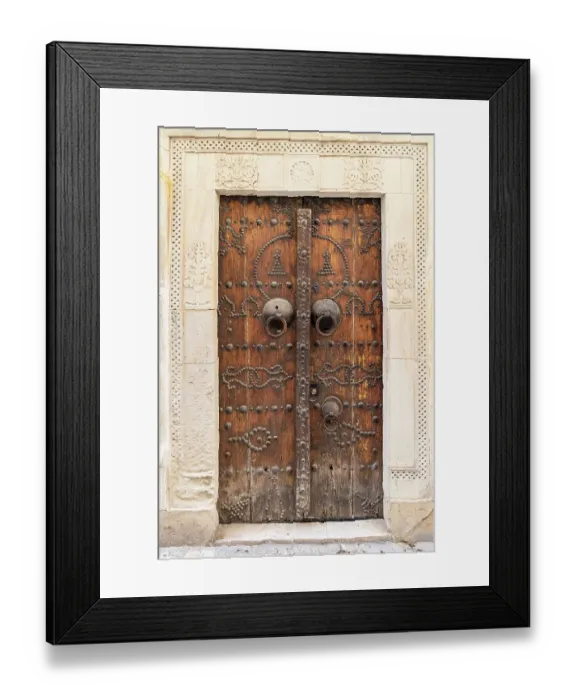Framed Print : Hammamet, Nabeul, Tunisia. A decorated wooden door on a building Framed Print : Hammamet, Nabeul, Tunisia. A decorated wooden door on a building